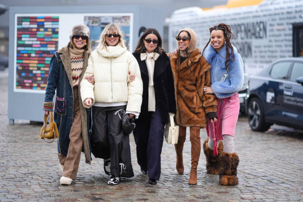 Five guests are posing, outside Rolf Ekroth, during the Copenhagen Fashion Week AW24 on January 30, 2024 in Copenhagen, Denmark.