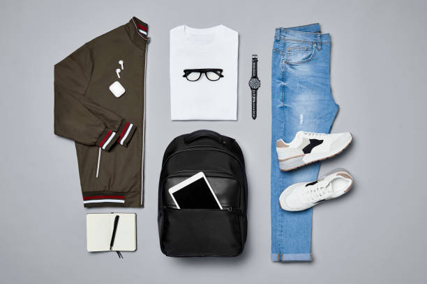 flat lay of traveler's clothes and accessories - fashion stock pictures, royalty-free photos & images