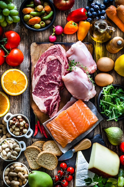 food backgrounds: table filled with large variety of food - food stock pictures, royalty-free photos & images