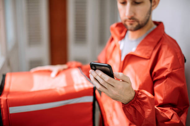 food delivery man getting ready for work - food stock pictures, royalty-free photos & images
