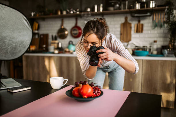 food photographer taking a photo of fruit - food stock pictures, royalty-free photos & images