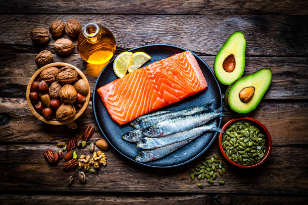 food with high content of healthy fats on rustic table. overhead view. - food stock pictures, royalty-free photos & images
