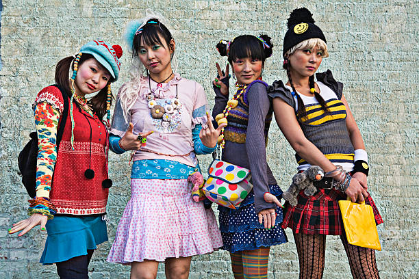 four women standing on sidewalk, portrait - fashion stock pictures, royalty-free photos & images