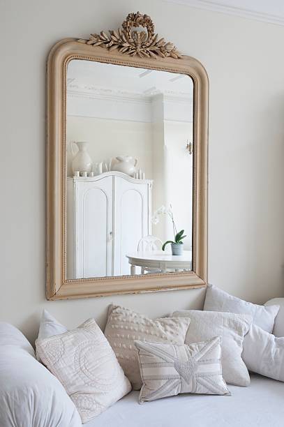 framed mirror above daybed with cushions - home decoration stock pictures, royalty-free photos & images
