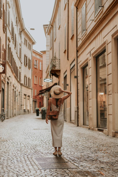 frau zu fuß in bologna - travel stock-fotos und bilder