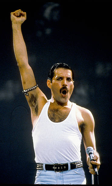 Freddie Mercury of the group Queen performs at the Live Aid concert on July 13, 1985 in London, England.