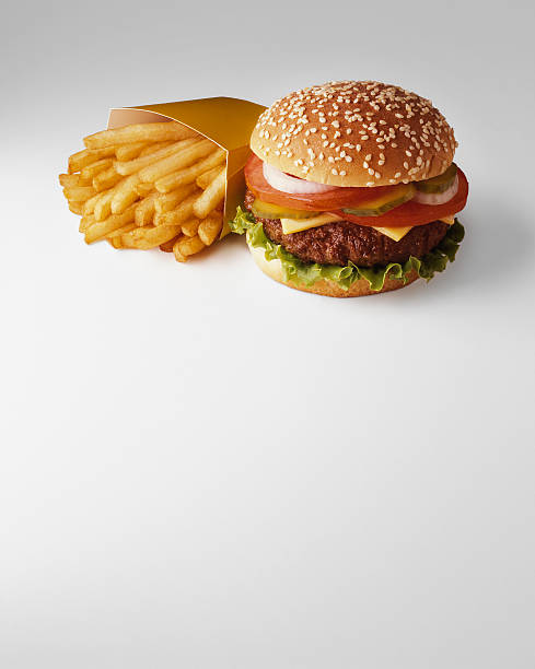french fries and hamburger - junk food stock pictures, royalty-free photos & images