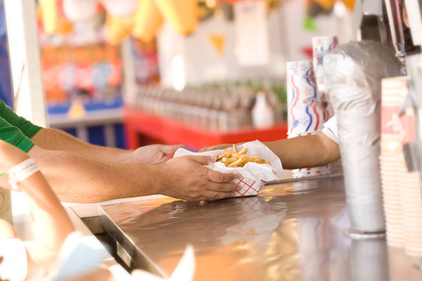 french fries being served at the fair - food stock pictures, royalty-free photos & images