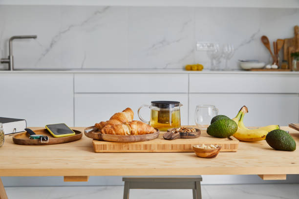 fresh croissants on the kitchen table - food stock pictures, royalty-free photos & images