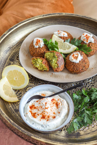 fresh falafel with lemon and yogurt dip - food stock pictures, royalty-free photos & images