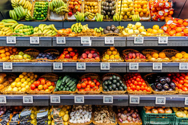 fresh fruits and vegetables on a market stall for sale at the supermarket - food stock pictures, royalty-free photos & images
