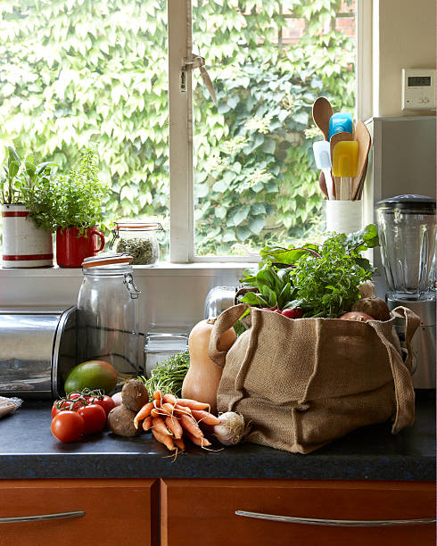 fresh vegetables in canvas bag on kitchen counter - food stock pictures, royalty-free photos & images