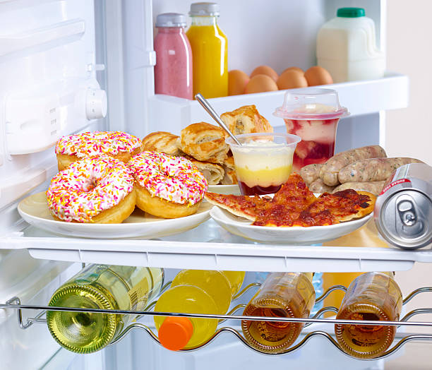 fridge containing unhealthy food - junk food stock pictures, royalty-free photos & images