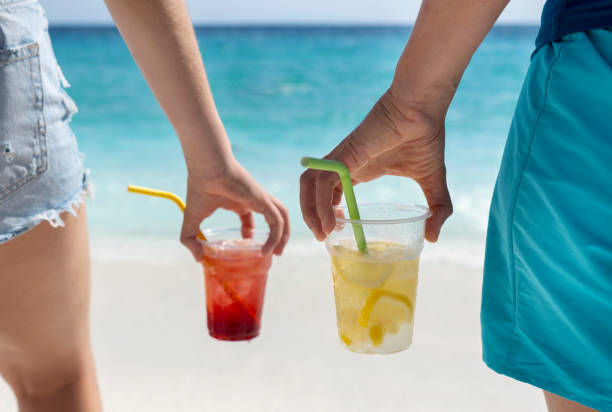 friends are sharing drinks on the beach - junk food stock pictures, royalty-free photos & images