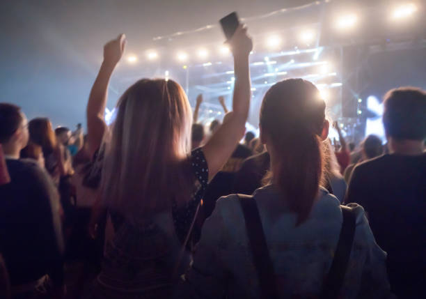 friends at concert dancing and enjoying music - concert stock pictures, royalty-free photos & images