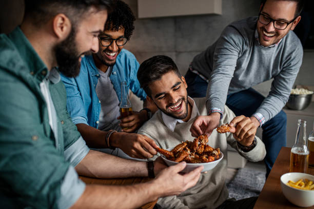 friends at home eating fast food - junk food stock pictures, royalty-free photos & images