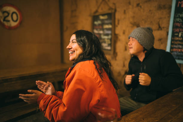 friends clapping in rustic bar - concert stock pictures, royalty-free photos & images