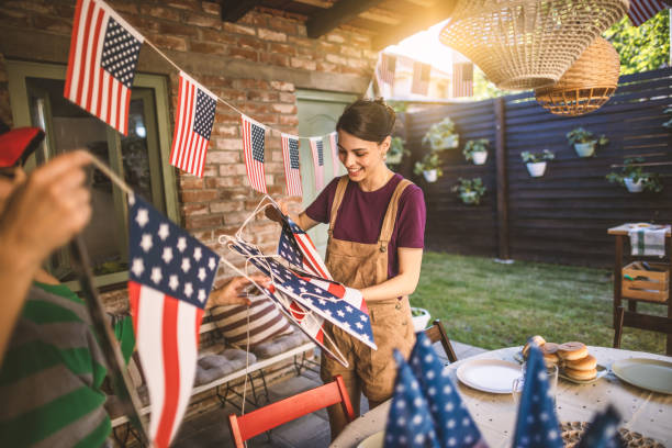 friends decorating backyard for celebration - garden decoration stock pictures, royalty-free photos & images