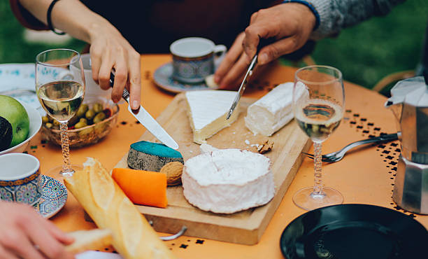 friends dining in the suburban garden of paris - food stock pictures, royalty-free photos & images