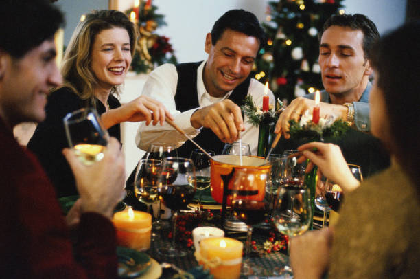 friends, dinner, christmas, home, fondue - food stock pictures, royalty-free photos & images