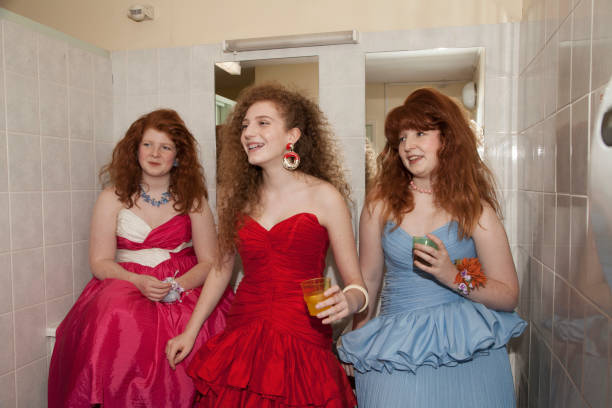 friends doing their make up in the bathroom at prom - fashion stock pictures, royalty-free photos & images