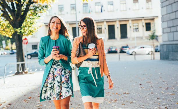 friends drinking coffee in the city - junk food stock pictures, royalty-free photos & images