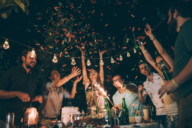friends having fun at birthday party - garden decoration stock pictures, royalty-free photos & images