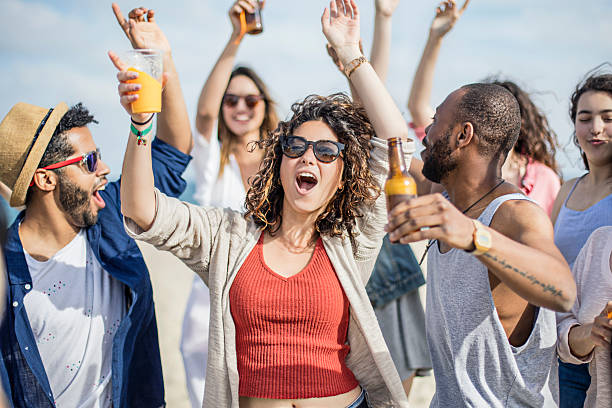 friends having fun on a party at the beach - concert stock pictures, royalty-free photos & images