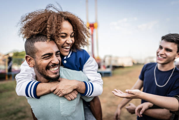friends having fun on the amusement park - concert stock pictures, royalty-free photos & images