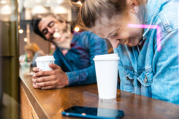 friends having fun together in a coffee shop - junk food stock pictures, royalty-free photos & images