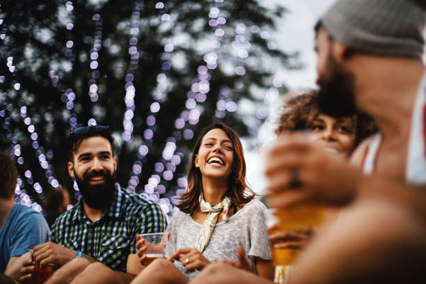 friends having some beers at a concert. - concert stock pictures, royalty-free photos & images