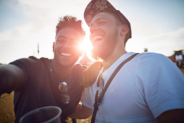 friends making selfie at big festival concert - concert stock pictures, royalty-free photos & images
