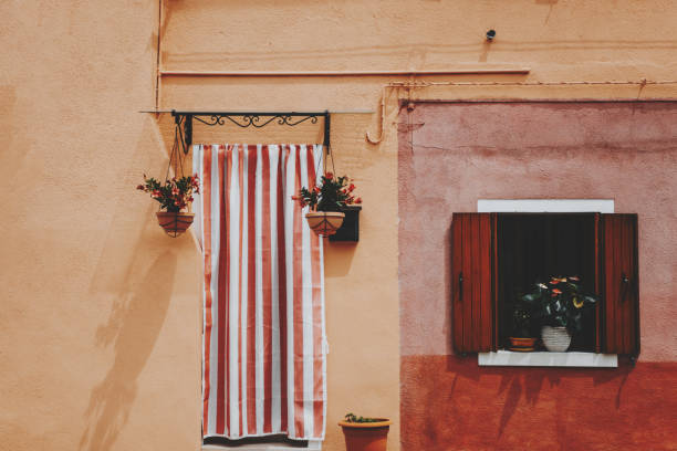 front door and colorful windows in burano,venize,italy - home decoration stock pictures, royalty-free photos & images