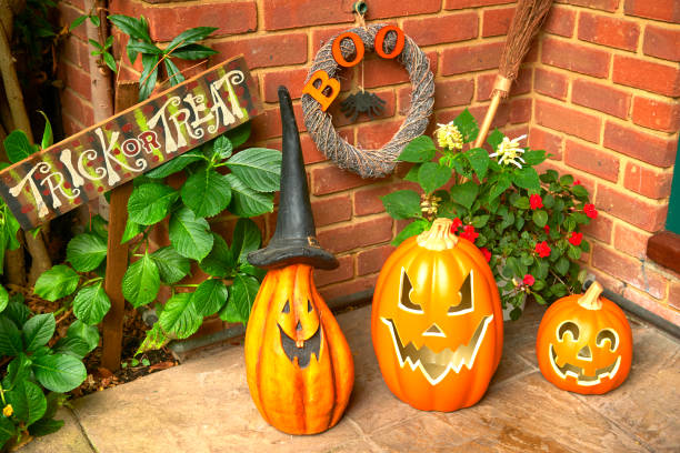front door pumpkins at halloween - garden decoration stock pictures, royalty-free photos & images