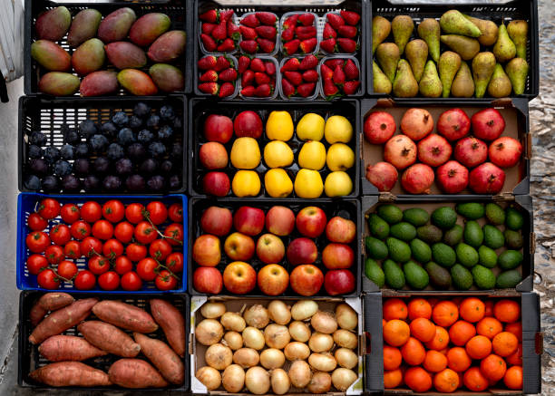 fruits and vegetables for sale at market stall - food stockfoto's en -beelden