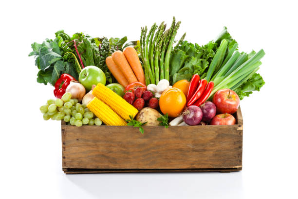 fruits and veggies in wood box with white backdrop - food stock pictures, royalty-free photos & images