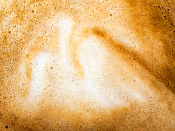 full frame of a cup of freshly made coffee with milk, backgrounds. - coffee stockfoto's en -beelden