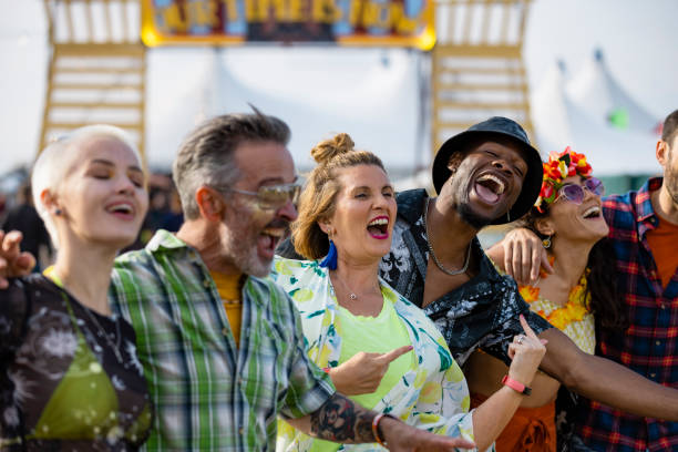 fun at a festival - concert stock pictures, royalty-free photos & images