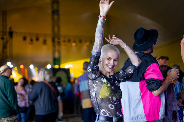 fun festival goer - concert stock pictures, royalty-free photos & images