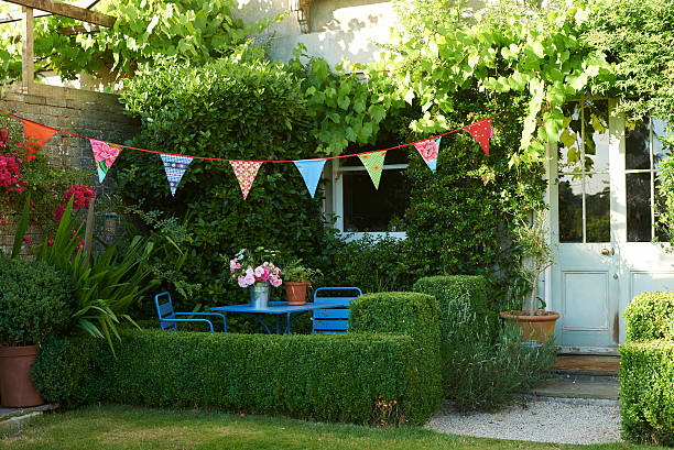 garden and bunting in summer - garden decoration stock pictures, royalty-free photos & images