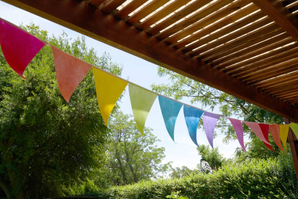 garden party under pennant flag - garden decoration stock pictures, royalty-free photos & images