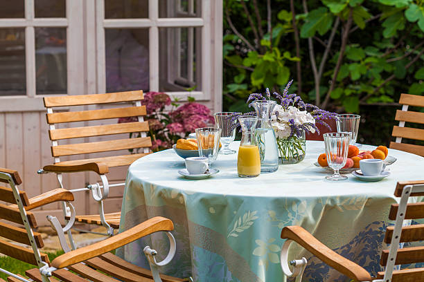 garden shed and laid table in garden - garden decoration stock pictures, royalty-free photos & images