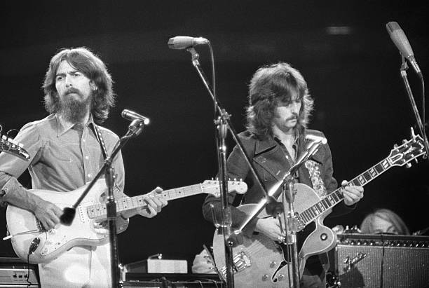 George Harrison and Eric Clapton performing at the Concert for Bangladesh at Madison Square Garden.