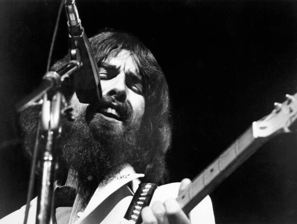 George Harrison performs onstage at the Concert for Bangladesh which was held at Madison Square Garden on August 1, 1971 in New York City, New York.