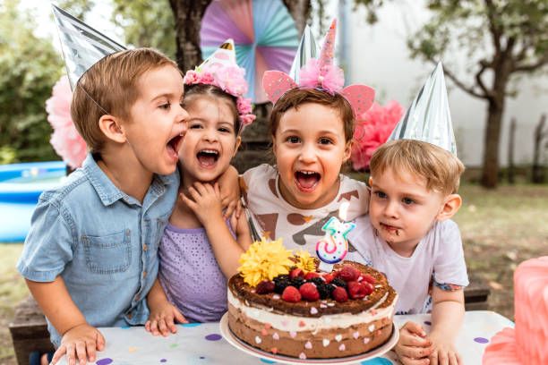 girl celebrating birthday with friends - garden decoration stock pictures, royalty-free photos & images
