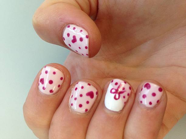 girl hand with nail art - nails art stock pictures, royalty-free photos & images