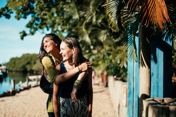 girlfriends discovering a beach town - travel stock pictures, royalty-free photos & images