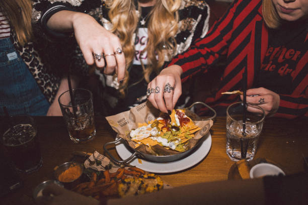 girlfriends on a night out - food stock pictures, royalty-free photos & images