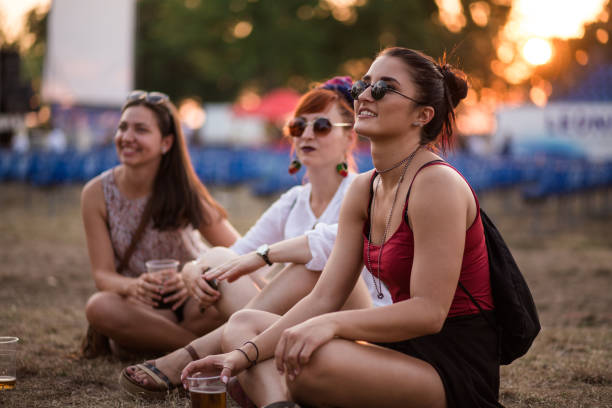girls enjoying summertime - concert stock pictures, royalty-free photos & images