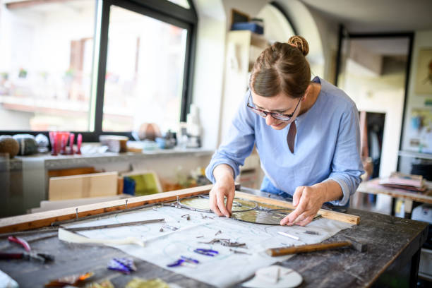 glass artist craftswoman working in her studio - nails art stock pictures, royalty-free photos & images